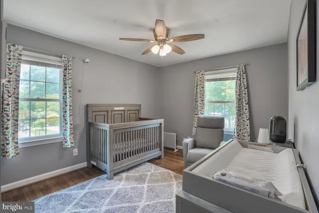 a bedroom with furniture and windows