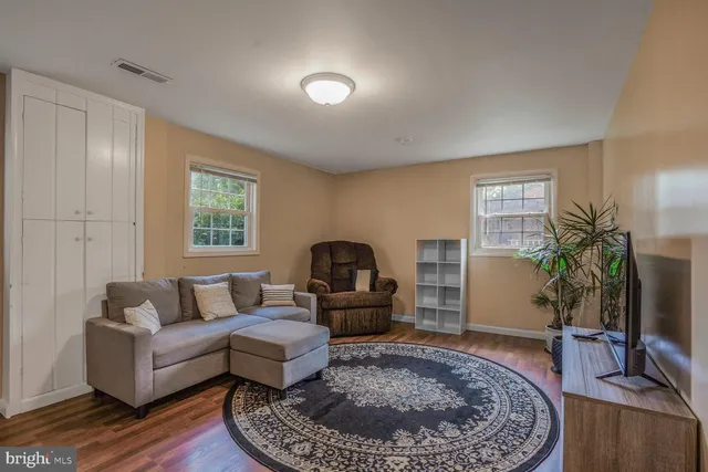 a living room with furniture and a rug