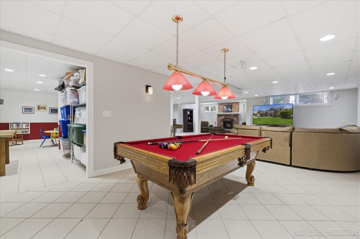 1914 North Ridge Avenue Arlington Heights, IL 60004 - Photo 37 of 50 a room with pool table and a flat screen tv