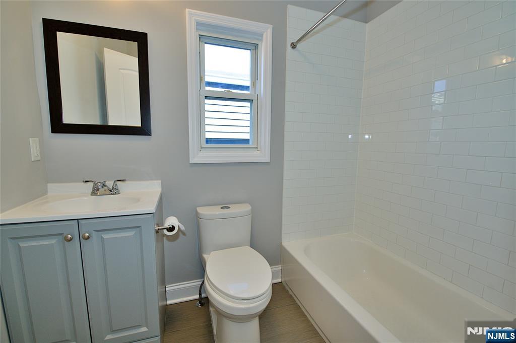 116 Maple Avenue, Unit 3 Montclair, NJ 07042 - Photo 10 of 12 a bathroom with a sink toilet and shower