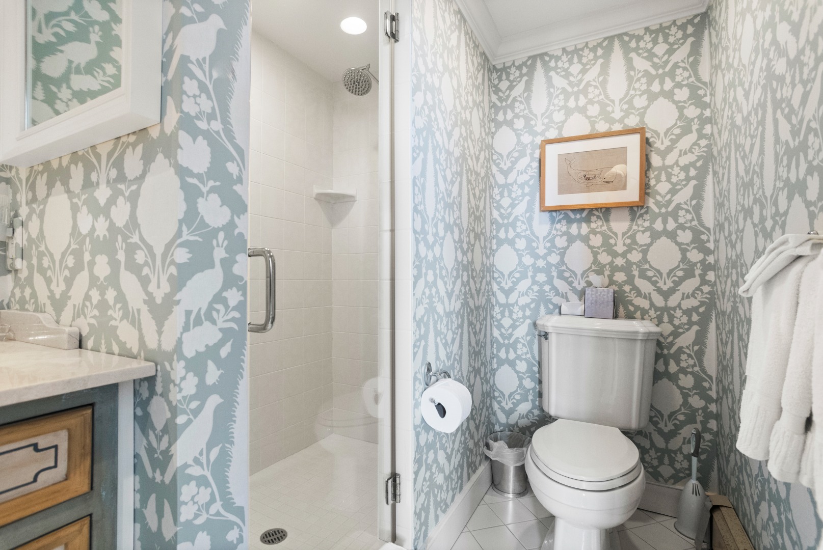 19 Orange Street Nantucket, MA 02554 - Photo 48 of 85 a bathroom with a toilet and a shower curtain