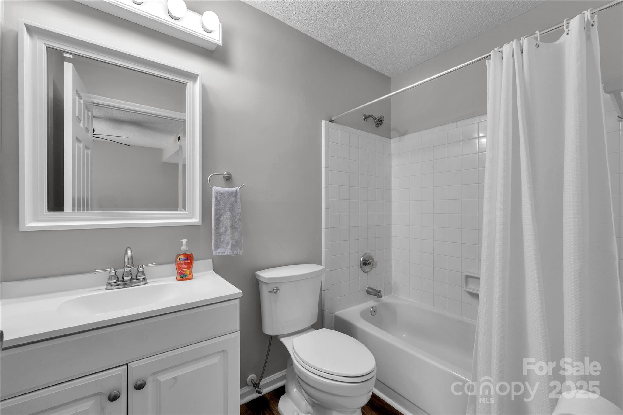 11014 Running Ridge Road Charlotte, NC 28226 - Photo 14 of 25 a bathroom with a sink toilet and shower