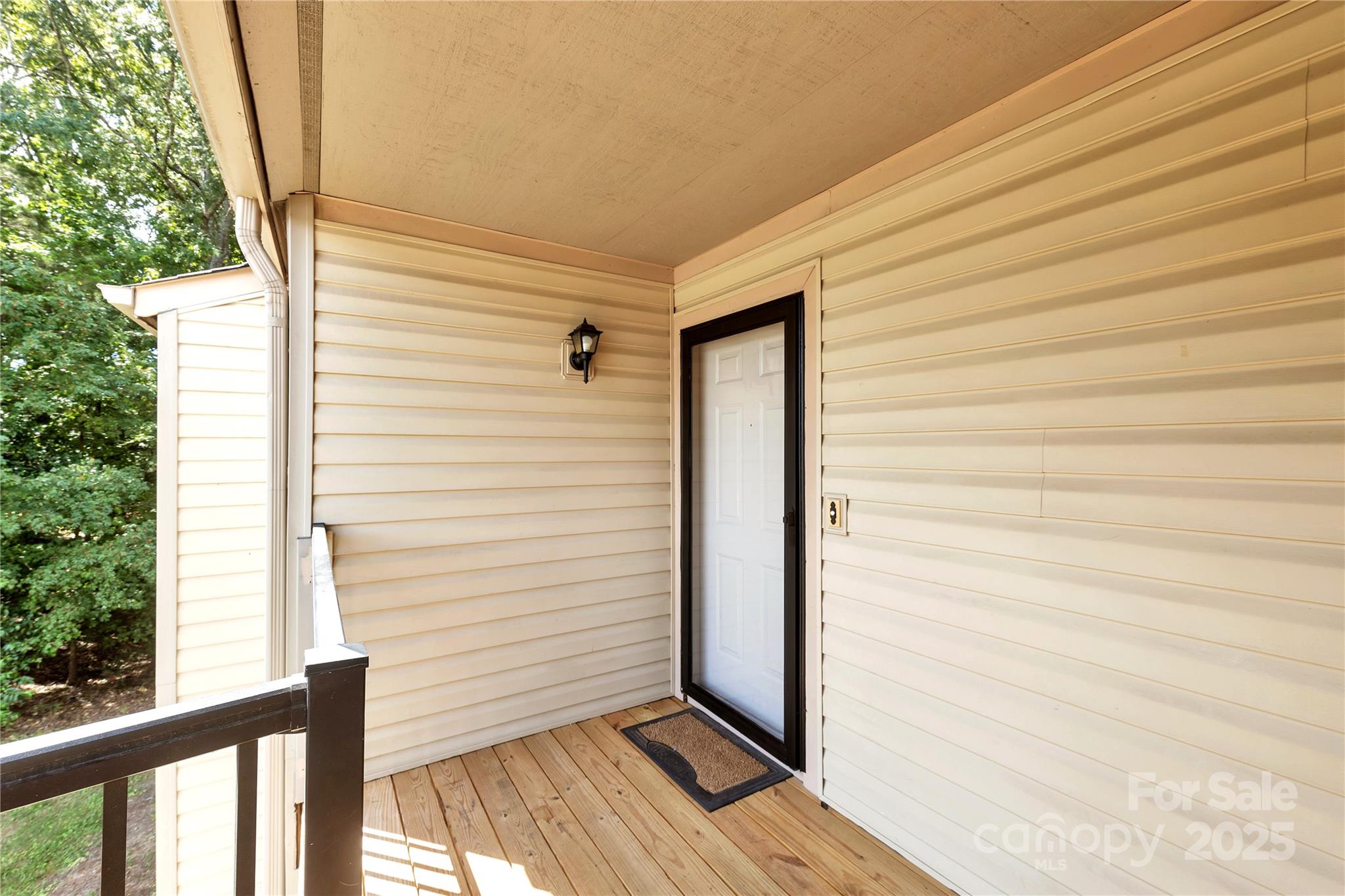 11014 Running Ridge Road Charlotte, NC 28226 - Photo 20 of 25 a view of a porch with wooden floor and stairs