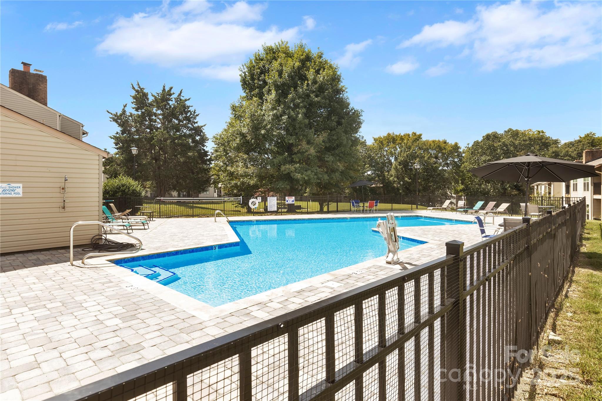 11014 Running Ridge Road Charlotte, NC 28226 - Photo 24 of 25 a view of a swimming pool with a patio