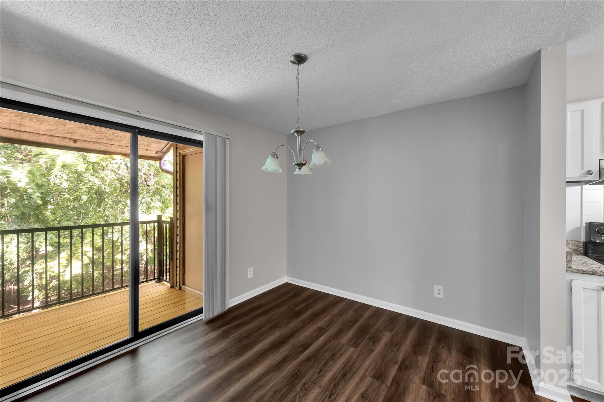 11014 Running Ridge Road Charlotte, NC 28226 - Photo 4 of 25 a view of empty room with wooden floor and fan