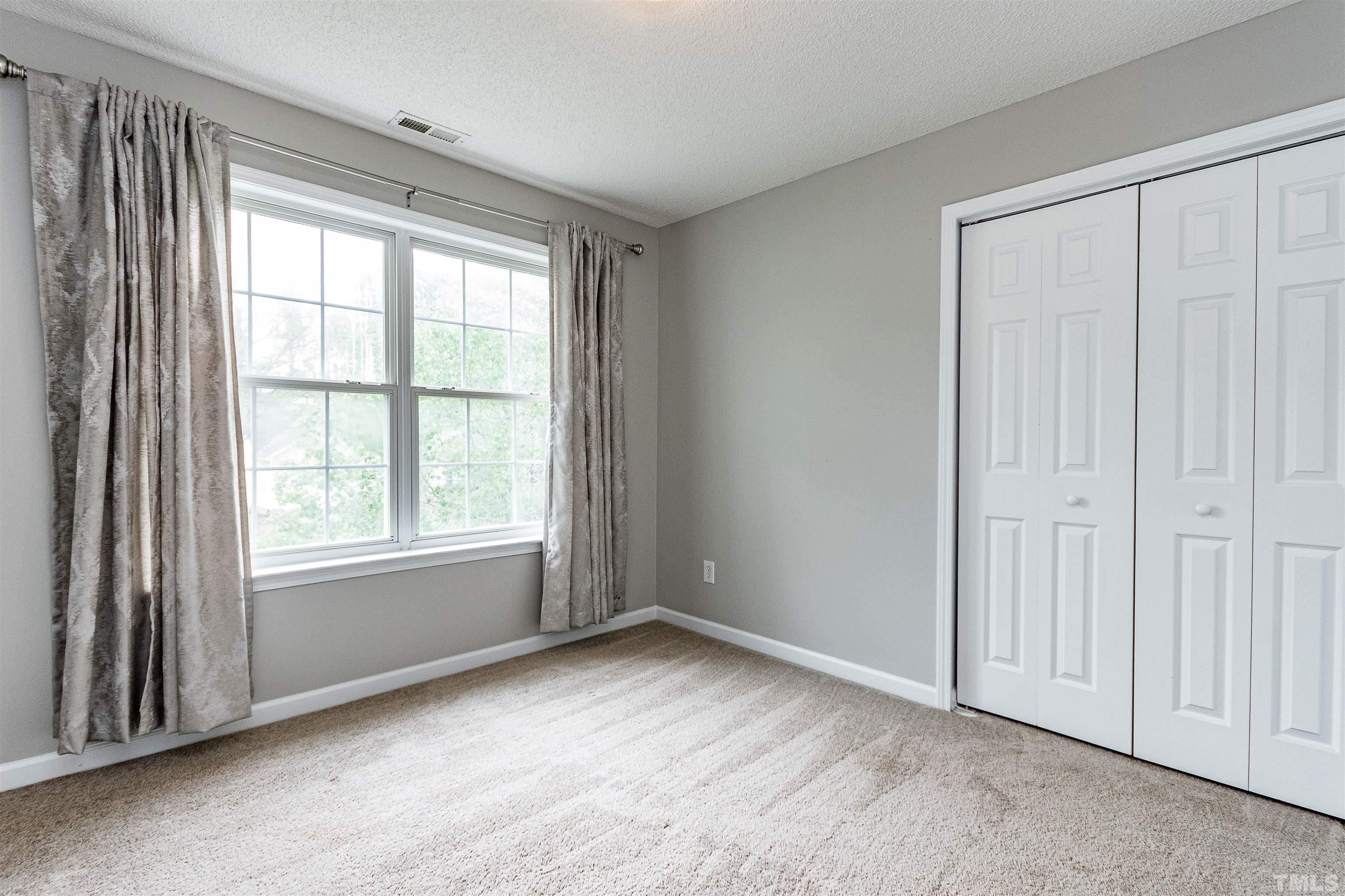 107 Ridge Lake Drive Apex, NC 27539 - Photo 14 of 27 a view of an empty room with a window