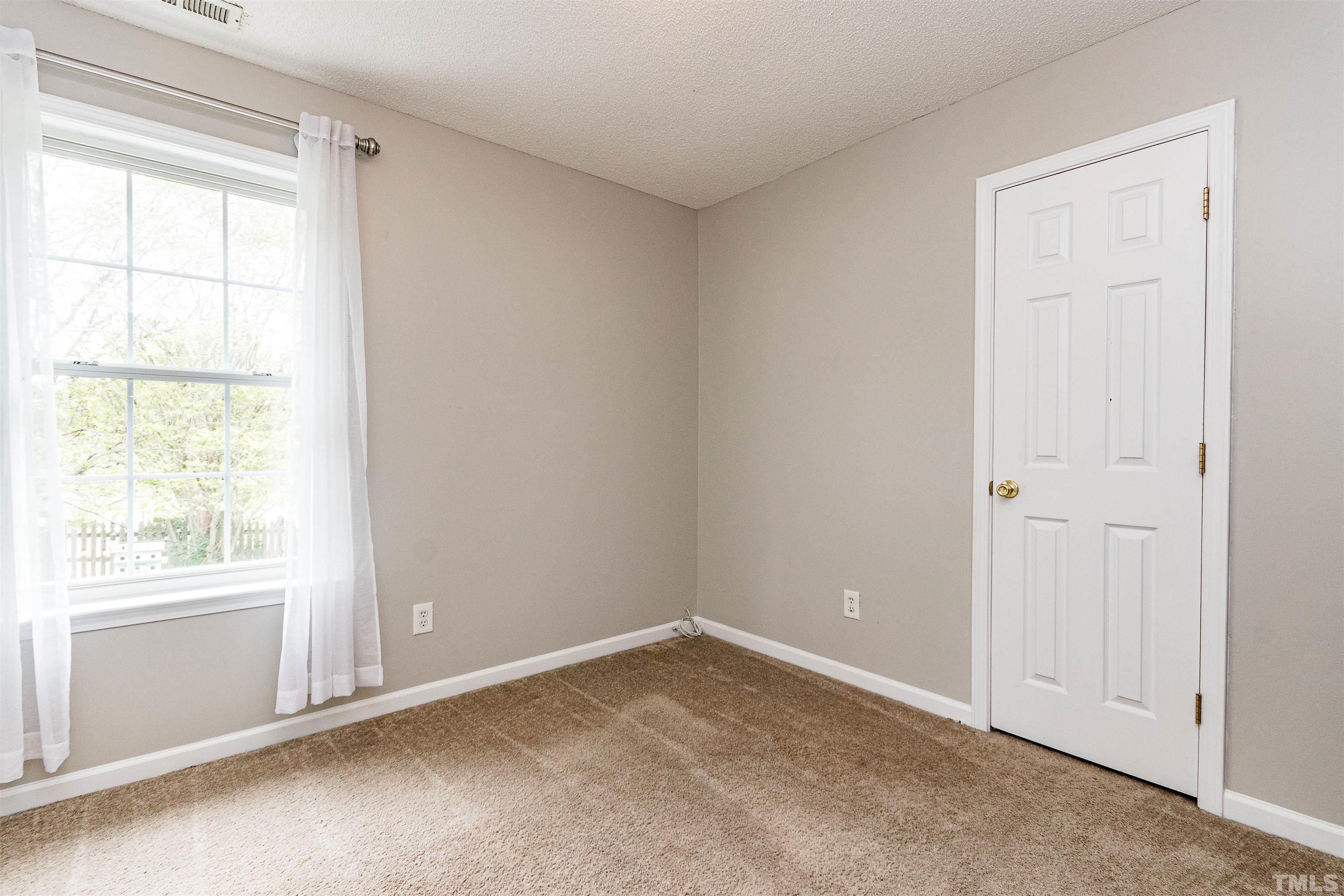 107 Ridge Lake Drive Apex, NC 27539 - Photo 15 of 27 an empty room with windows