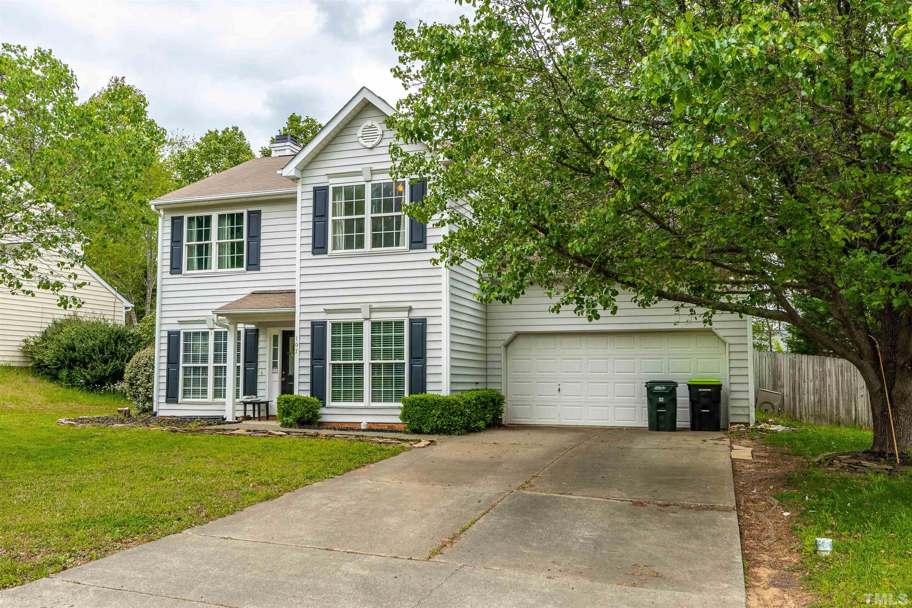 107 Ridge Lake Drive Apex, NC 27539 - Photo 2 of 27 a front view of a house with a yard and garage