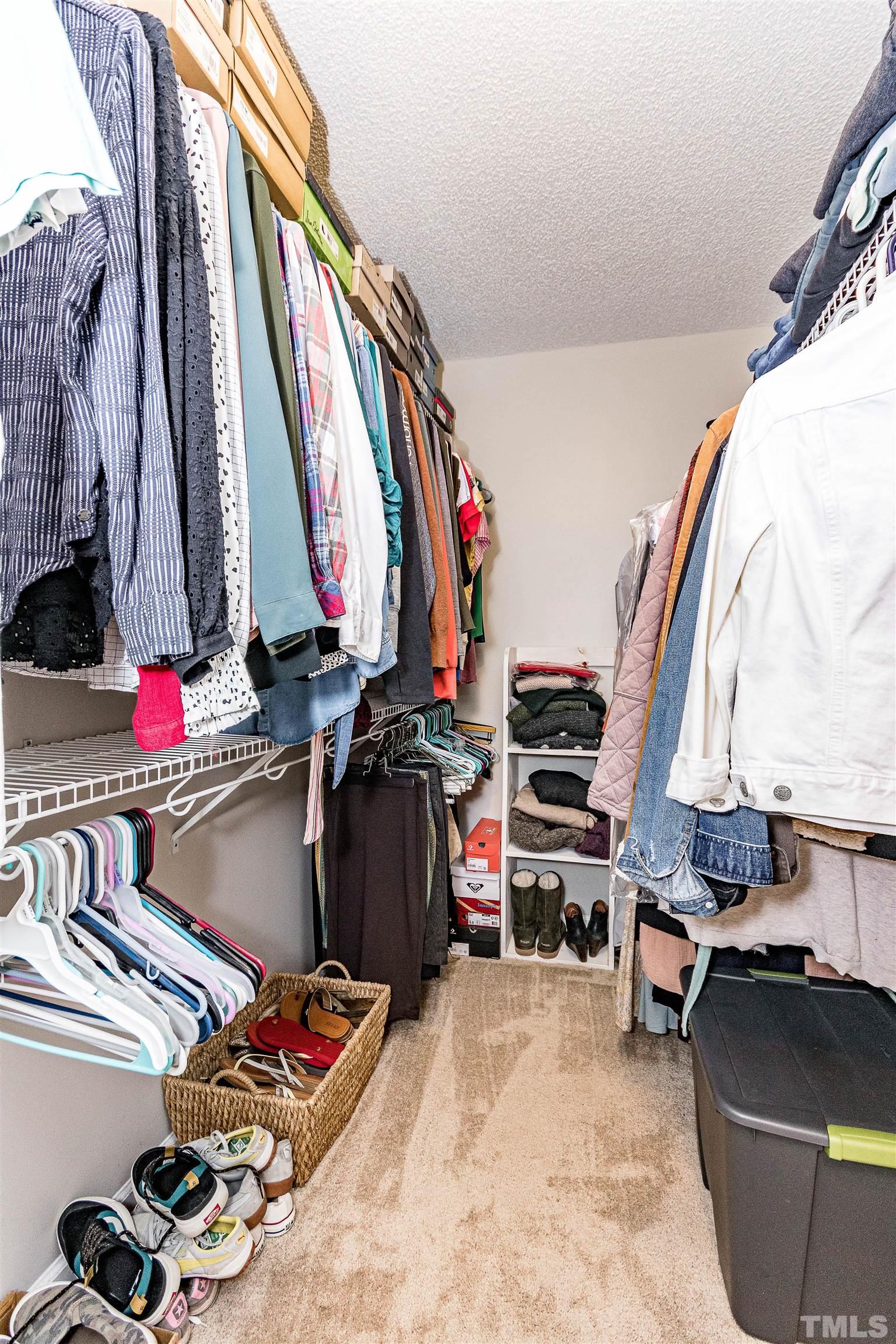 107 Ridge Lake Drive Apex, NC 27539 - Photo 21 of 27 a view of walk in closet with clothes and shoes
