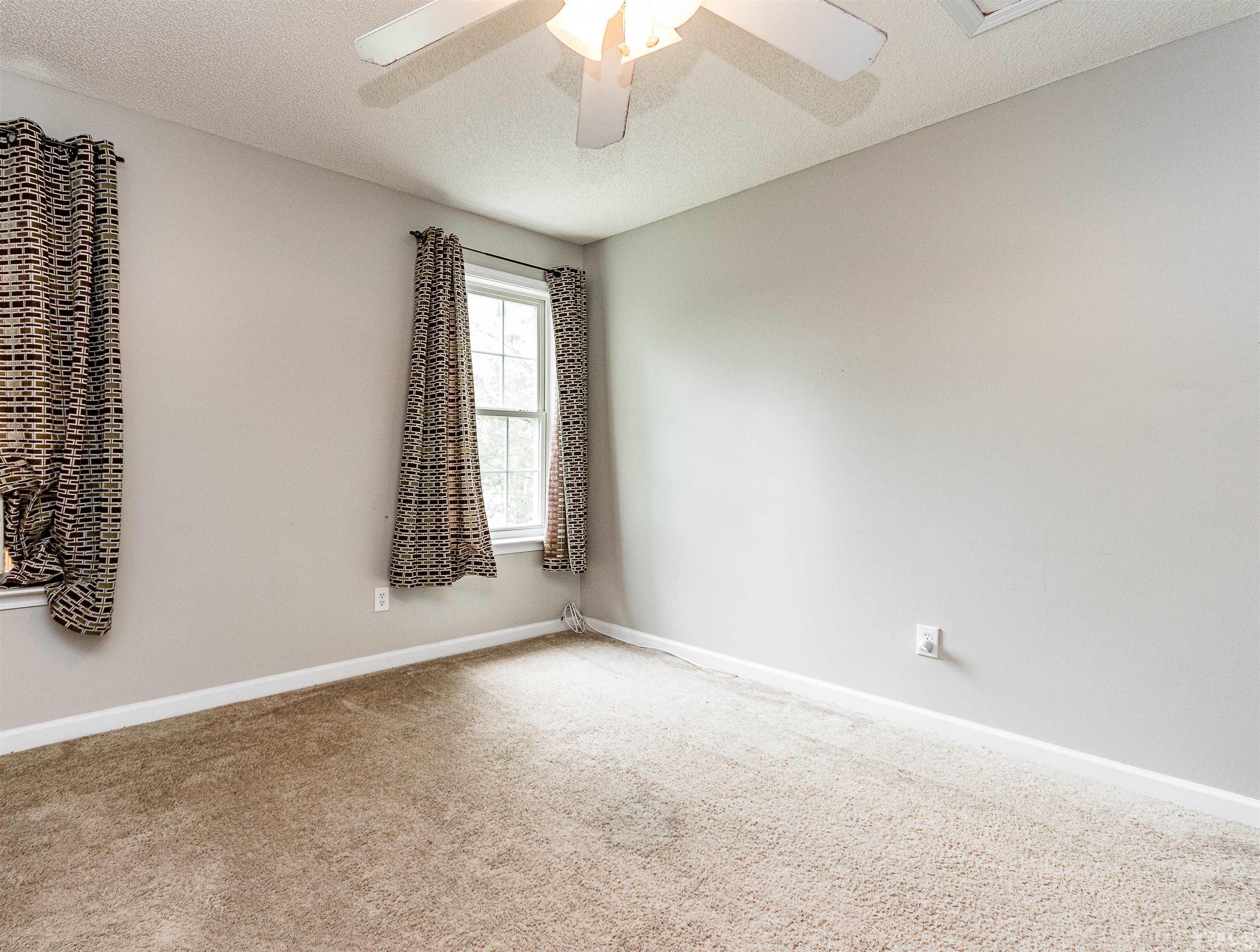 107 Ridge Lake Drive Apex, NC 27539 - Photo 22 of 27 a view of an empty room with a window
