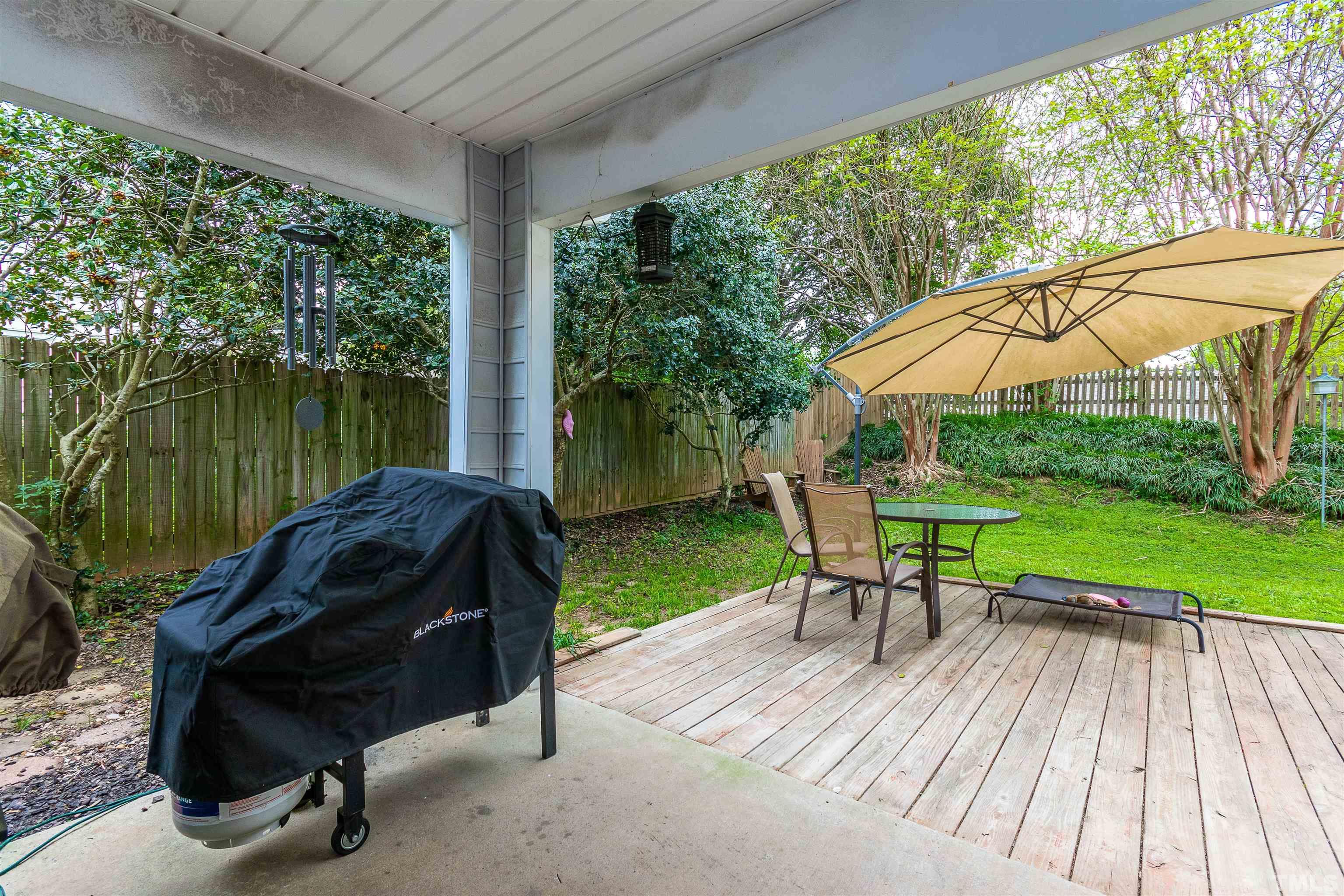 107 Ridge Lake Drive Apex, NC 27539 - Photo 23 of 27 a view of backyard with hardwood floor and outdoor seating