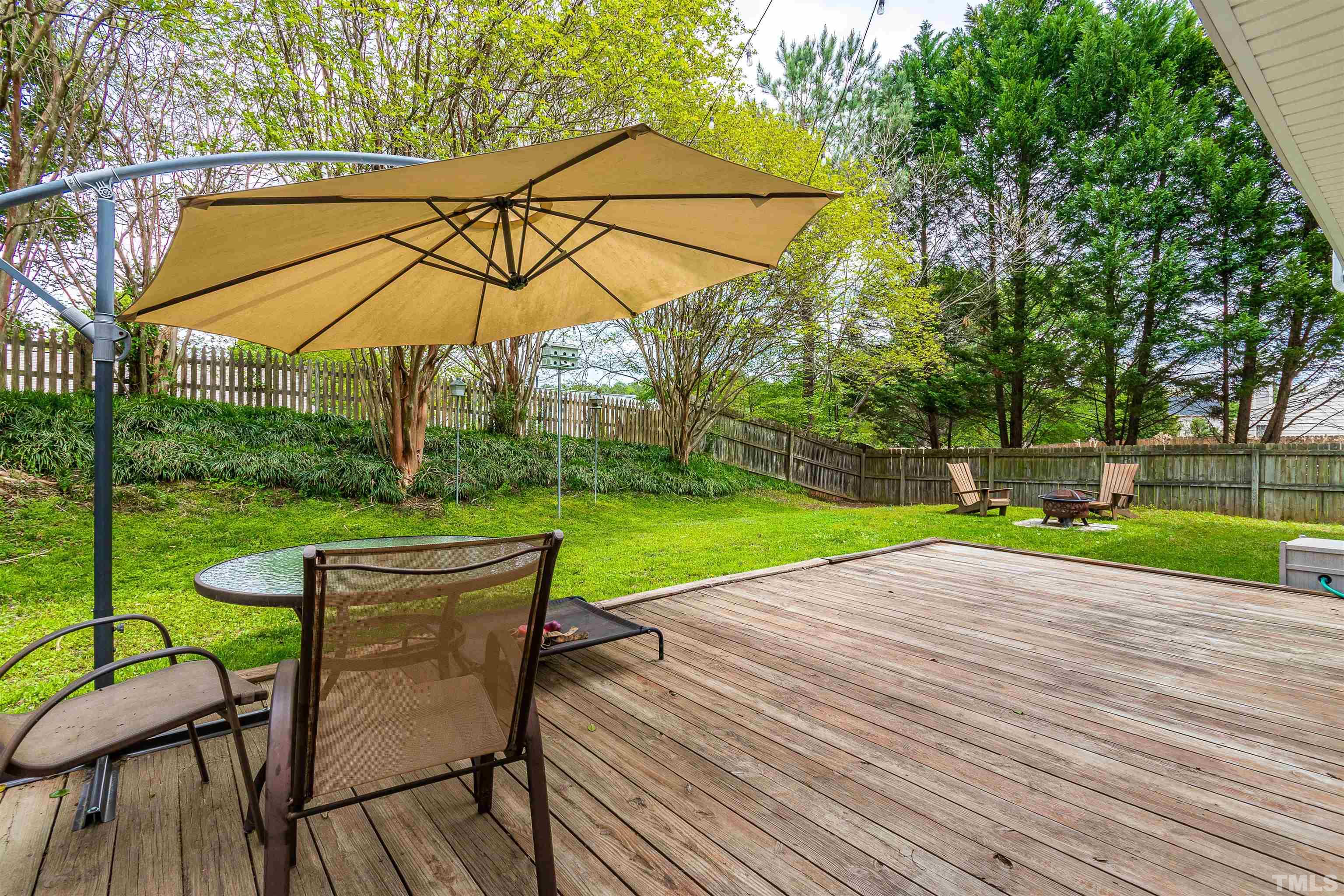 107 Ridge Lake Drive Apex, NC 27539 - Photo 24 of 27 a view of a table and chairs in the garden