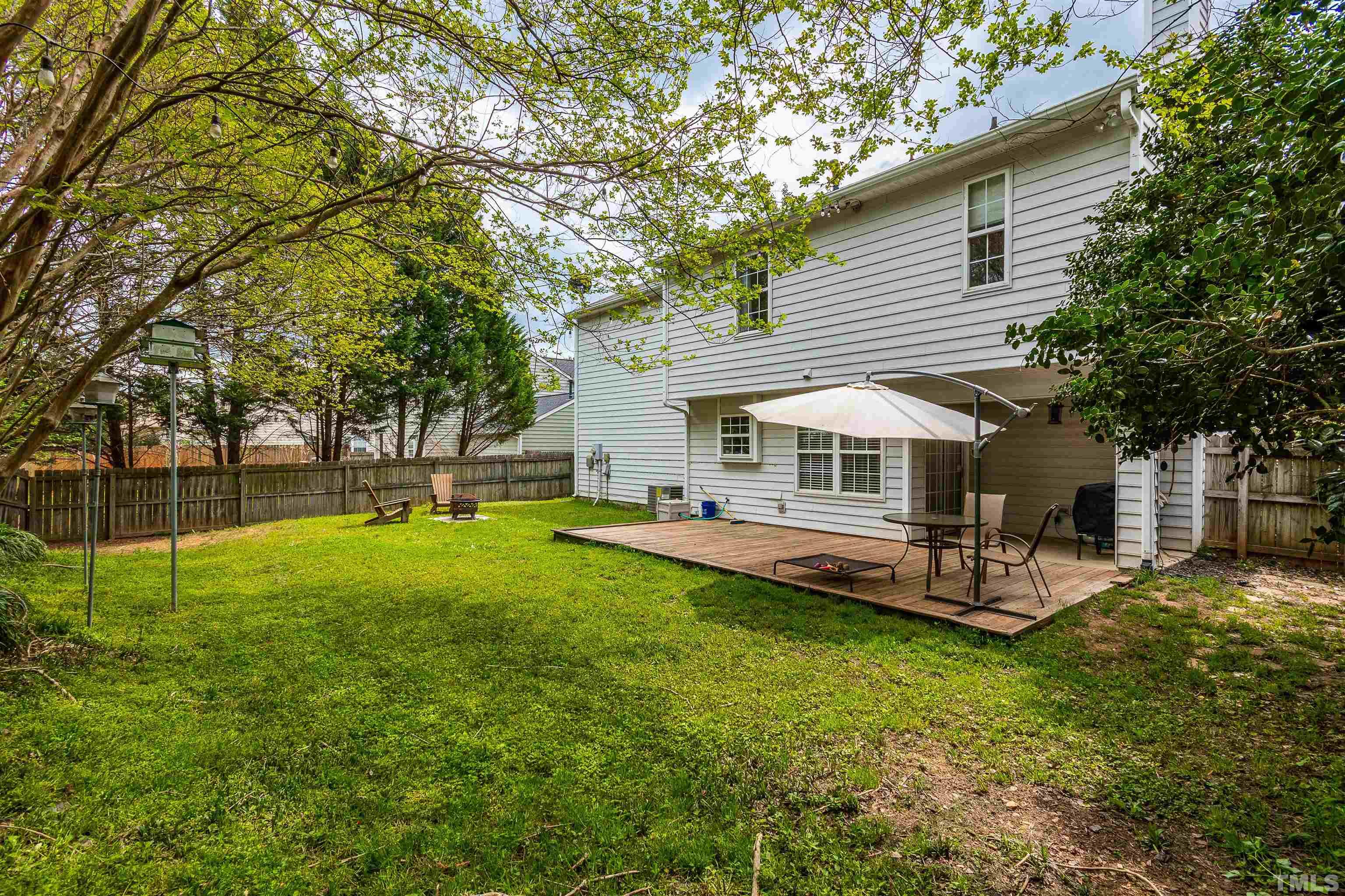 107 Ridge Lake Drive Apex, NC 27539 - Photo 25 of 27 a view of a house with backyard and sitting area