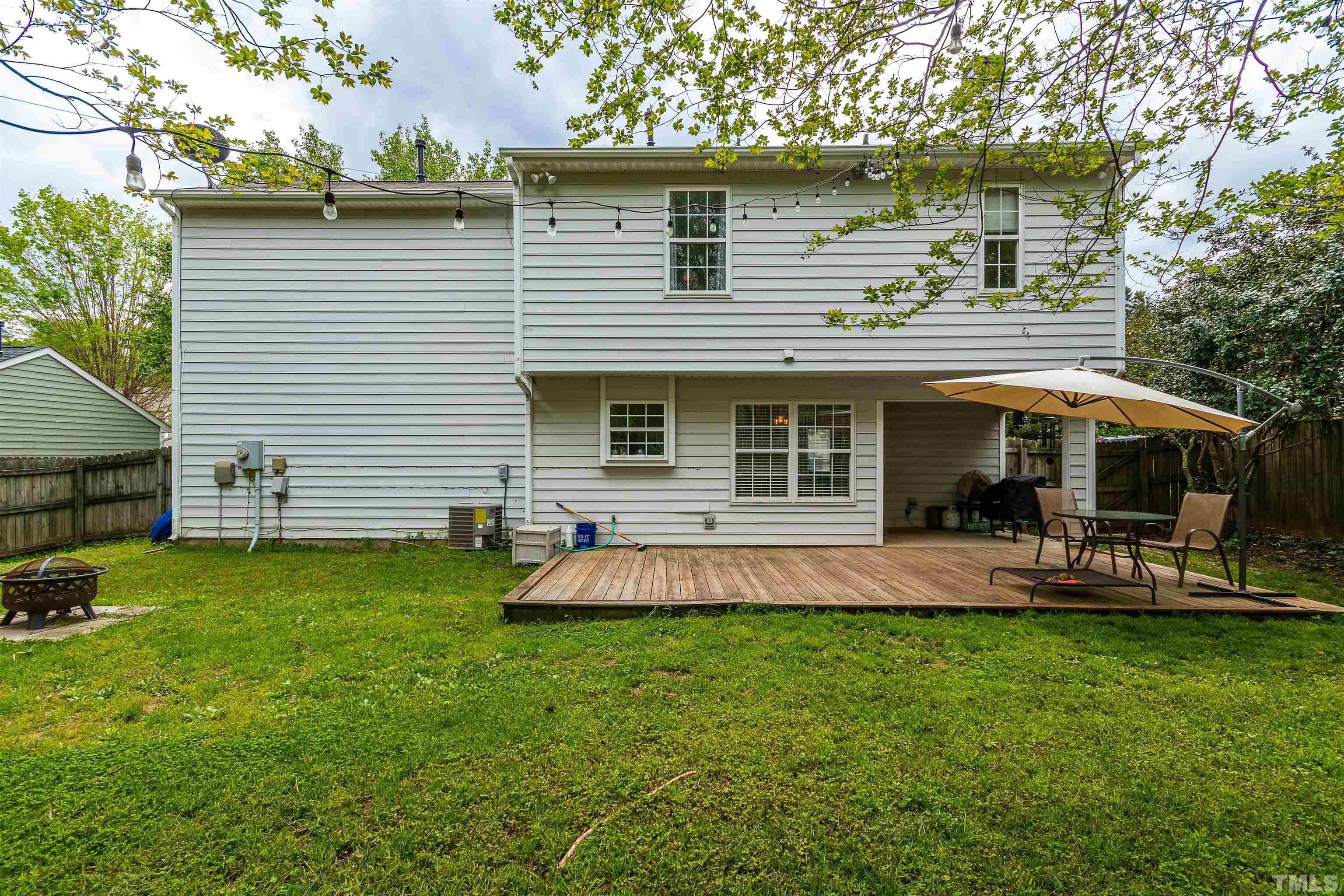 107 Ridge Lake Drive Apex, NC 27539 - Photo 26 of 27 a view of a house with a yard and sitting area