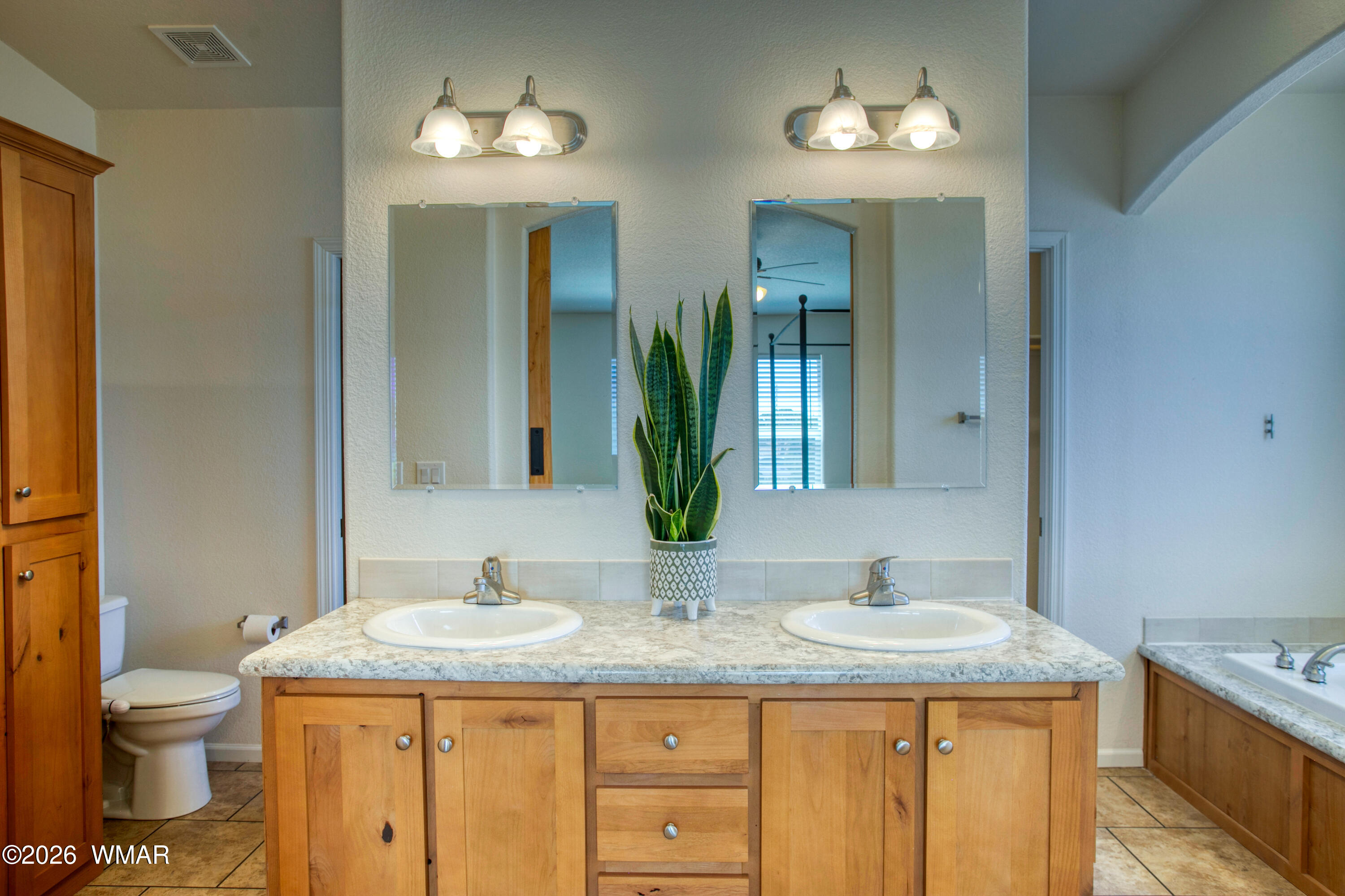 3869 Petersen Road Snowflake, AZ 85937 - Photo 12 of 29 a bathroom with a granite countertop sink and a mirror