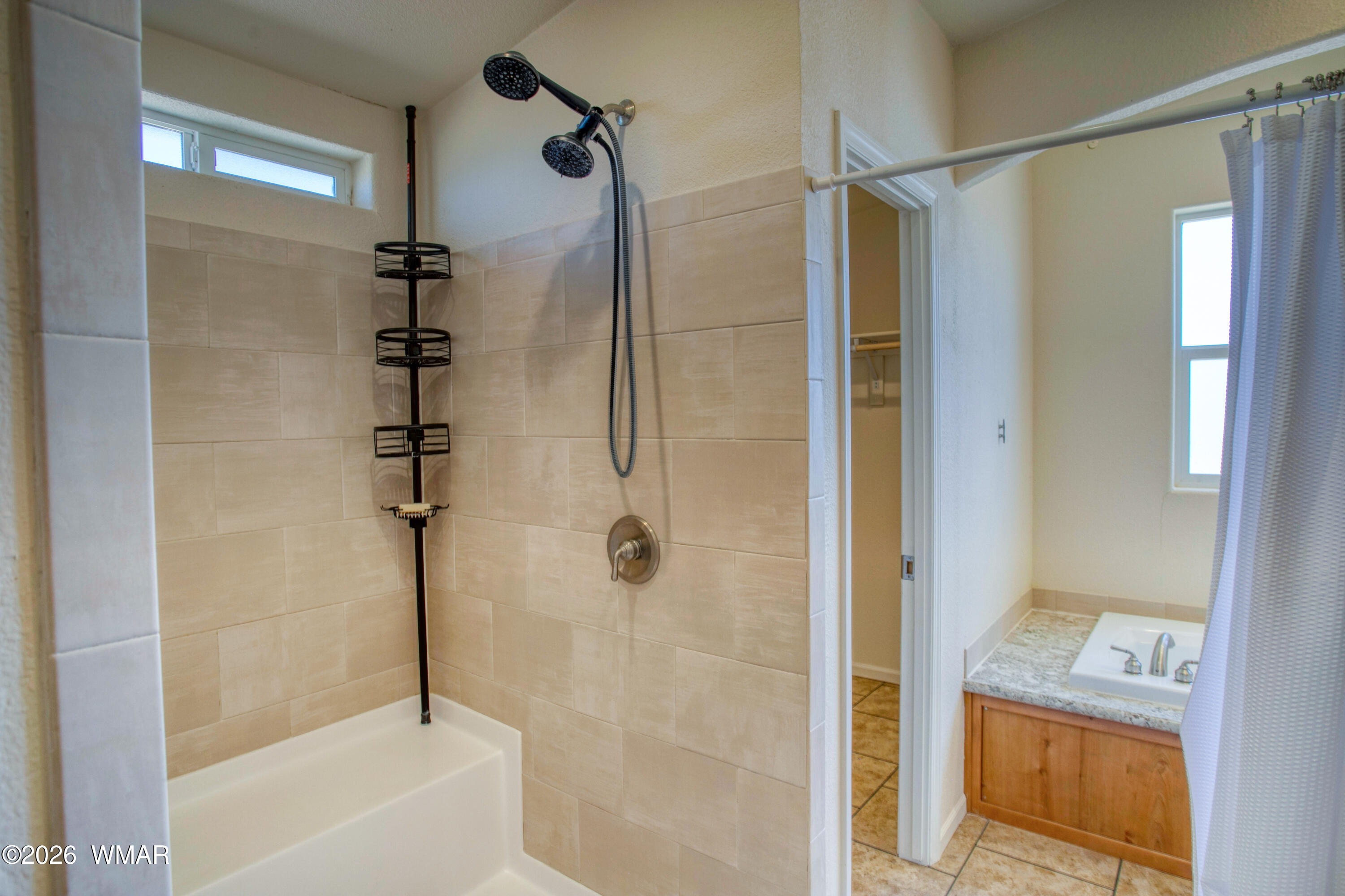 3869 Petersen Road Snowflake, AZ 85937 - Photo 16 of 29 a bathroom with a shower and a bath tub