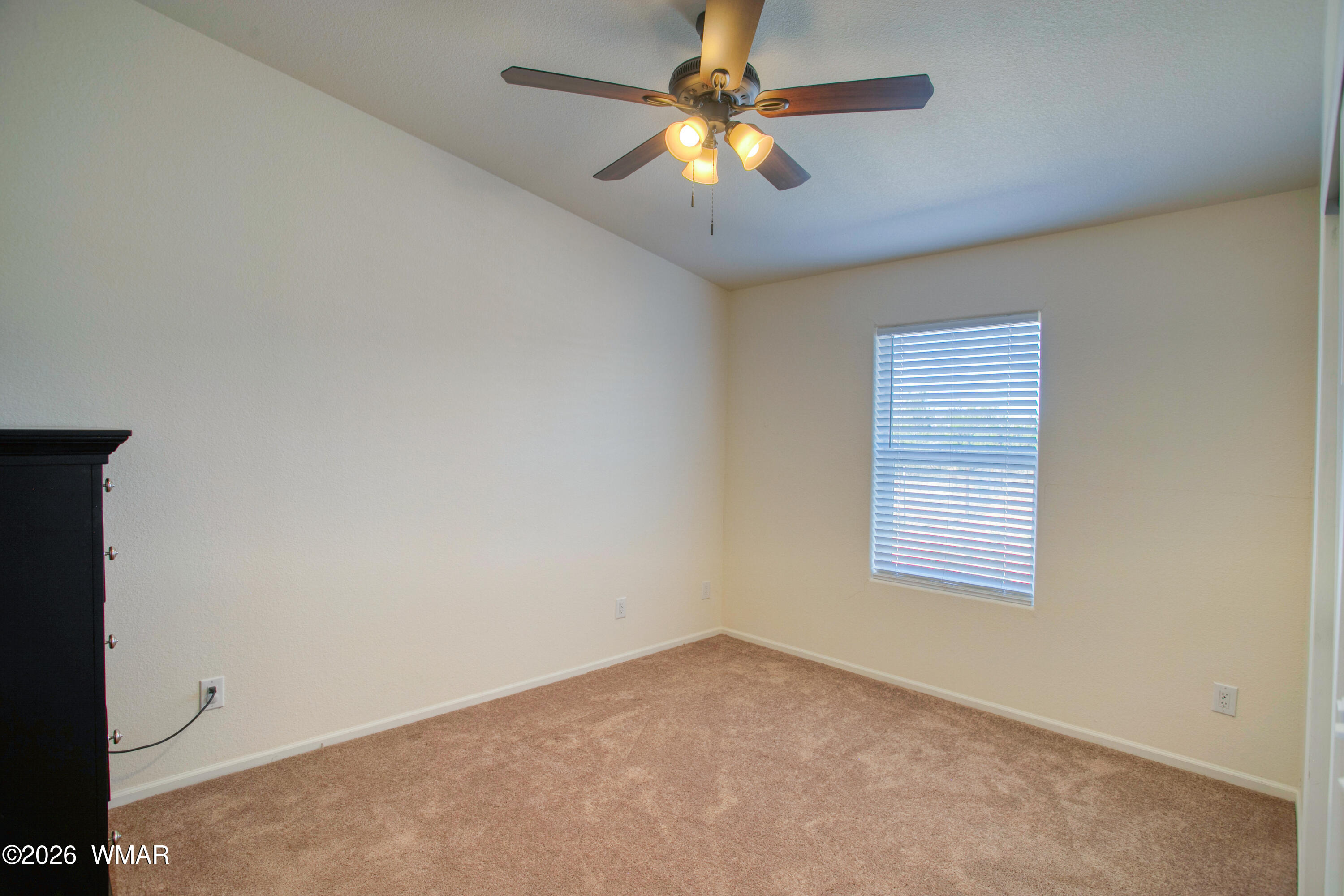 3869 Petersen Road Snowflake, AZ 85937 - Photo 17 of 29 an empty room with a window and a fan