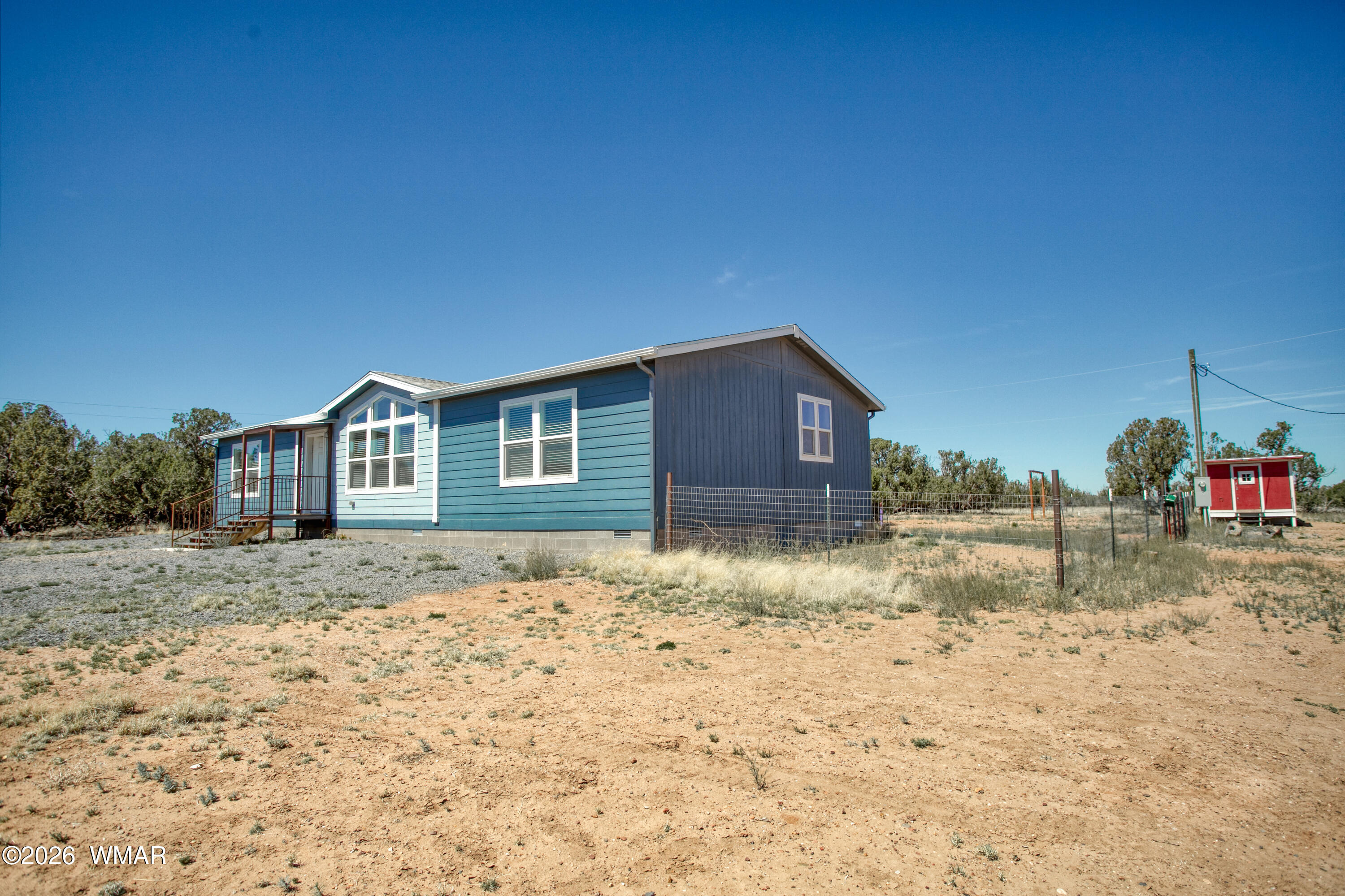 3869 Petersen Road Snowflake, AZ 85937 - Photo 26 of 29 a house view with wooden fence