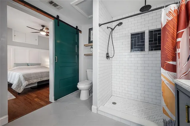 a bathroom with a shower and a sink