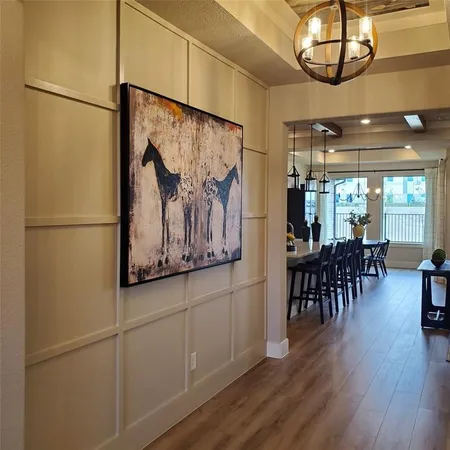 an entryway with wooden floor