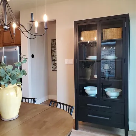 a dining room with table and chairs