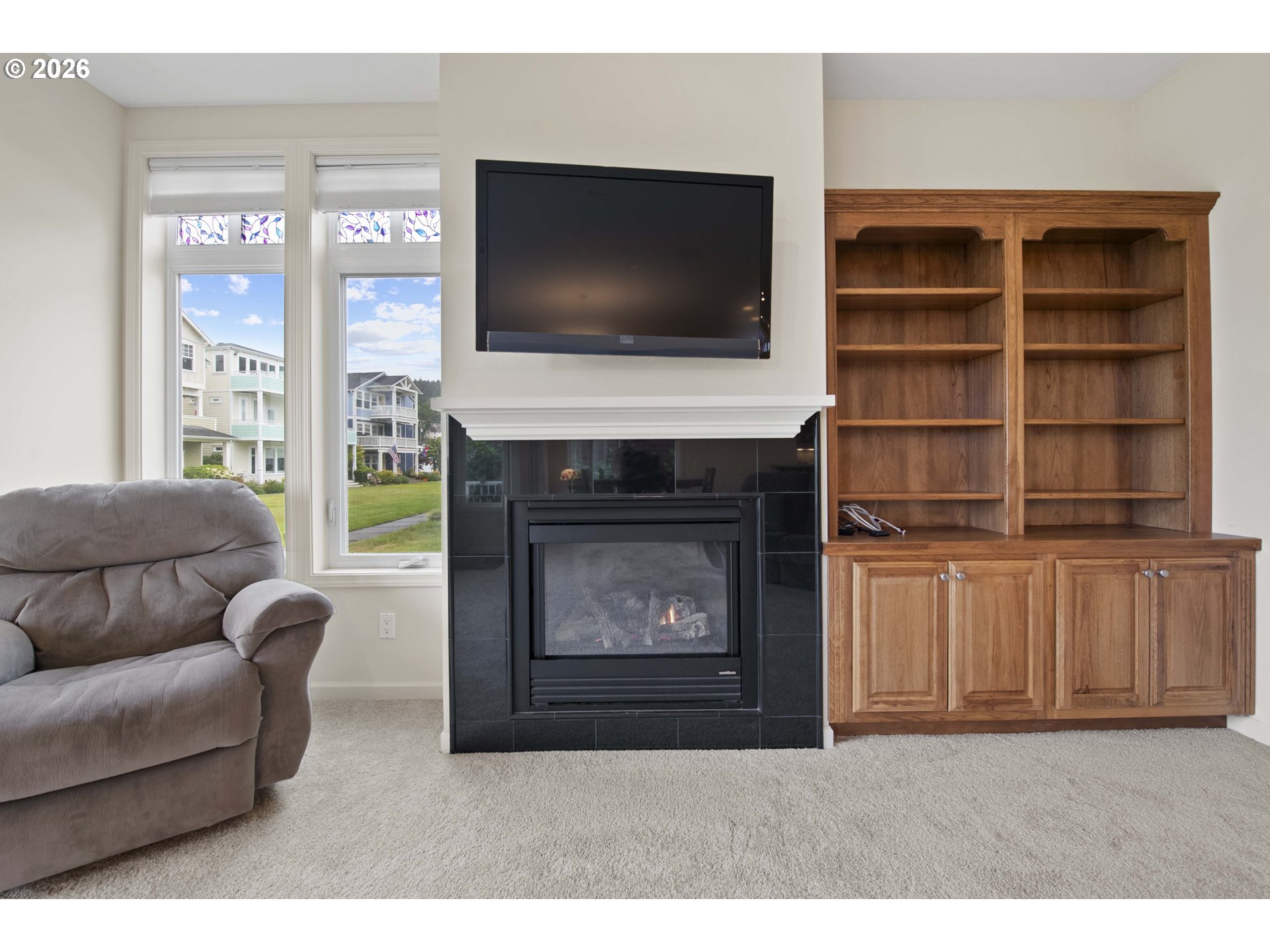 230 Round House Road Astoria, OR 97103 - Photo 7 of 43 a living room with furniture and a fireplace