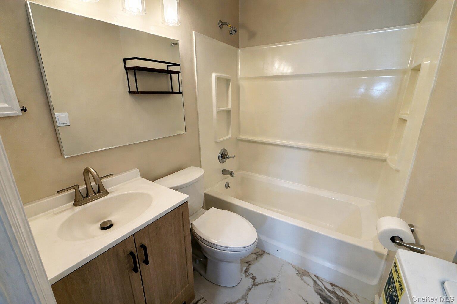 25 Lexington Hills Road, Unit 8 Harriman, NY 10926 - Photo 13 of 24 a bathroom with a sink a toilet and a bathtub