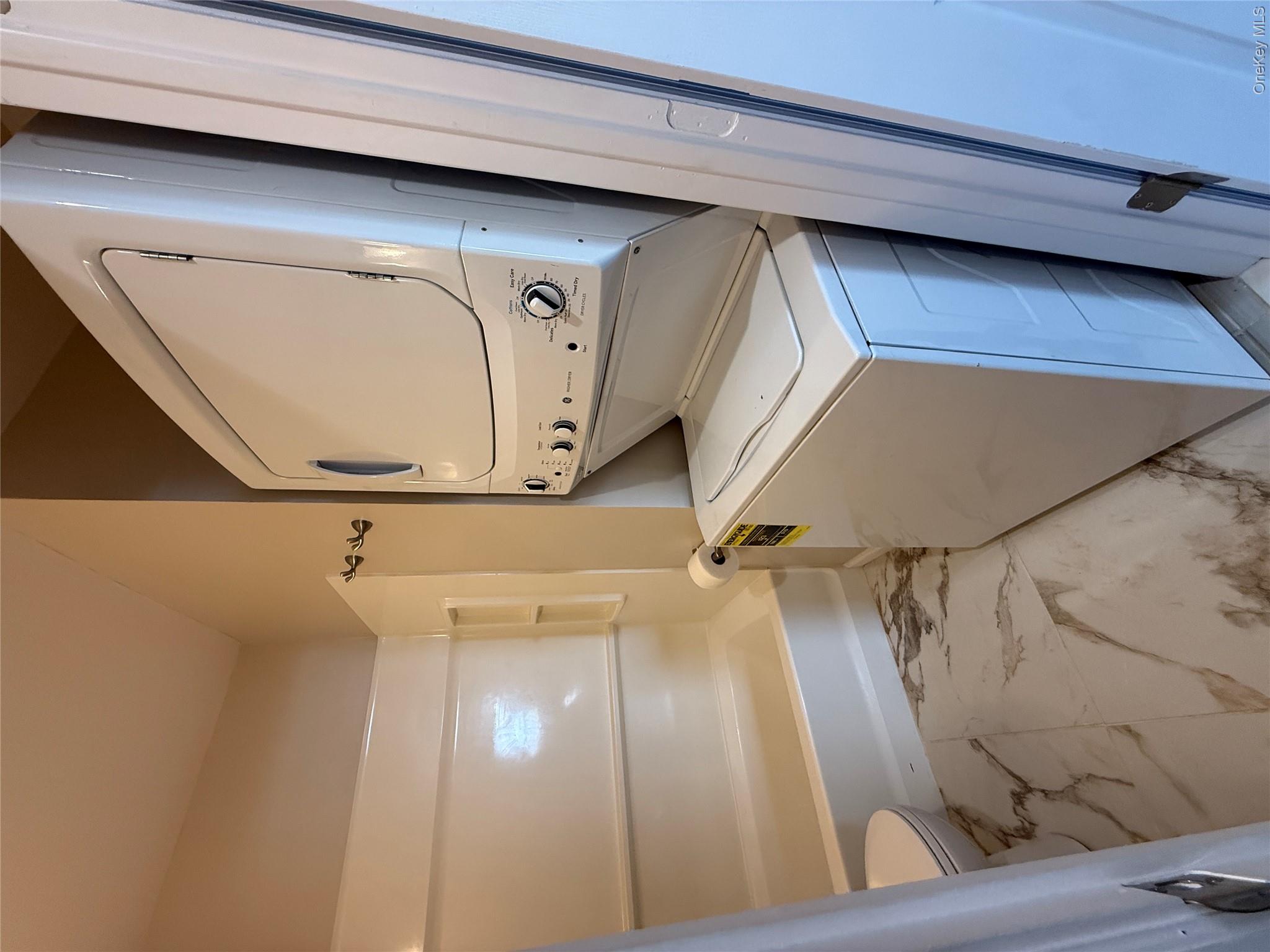 25 Lexington Hills Road, Unit 8 Harriman, NY 10926 - Photo 16 of 24 a utility room with dryer and washer