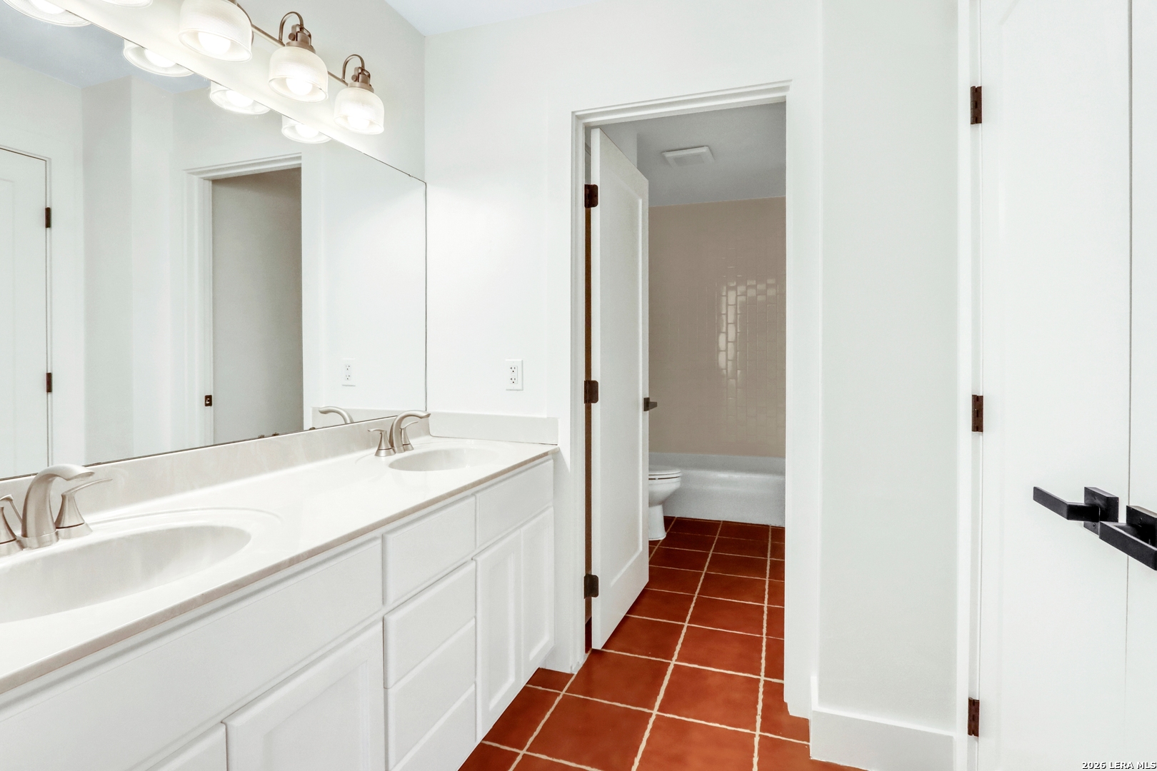 551 Terminal Loop Road, Unit B3 McQueeney, TX 78123 - Photo 17 of 18 a bathroom with a sink and a mirror