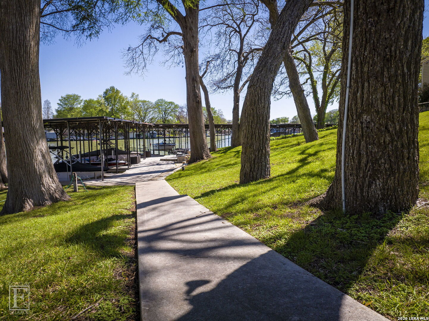 551 Terminal Loop Road, Unit B3 McQueeney, TX 78123 - Photo 18 of 18 a view of a garden with lake