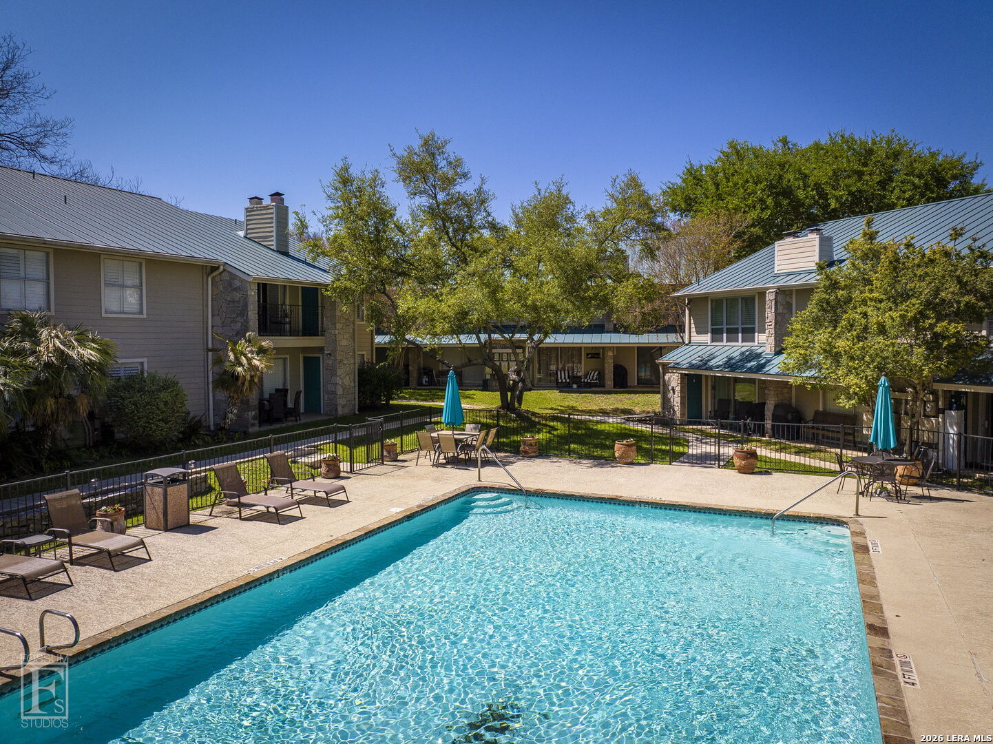 551 Terminal Loop Road, Unit B3 McQueeney, TX 78123 - Photo 3 of 18 a view of a house with swimming pool having outdoor seating
