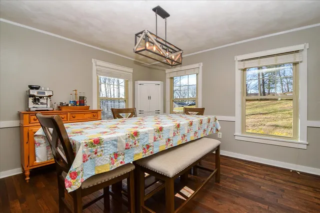 a bed room with a bed mirror and a window