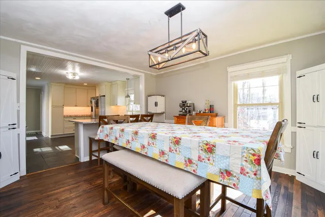 a very nice looking dining room with a table and chairs