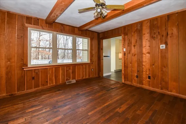 a living room with couch and a large window