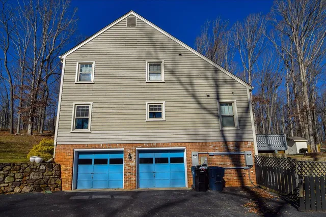 a view of a yard with large trees