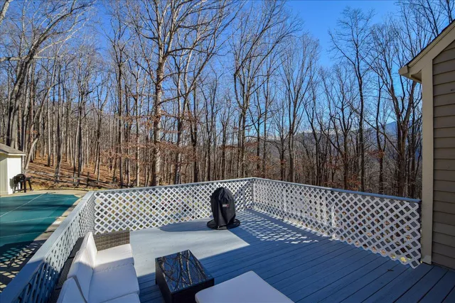 a view of a deck with couches and wooden floor