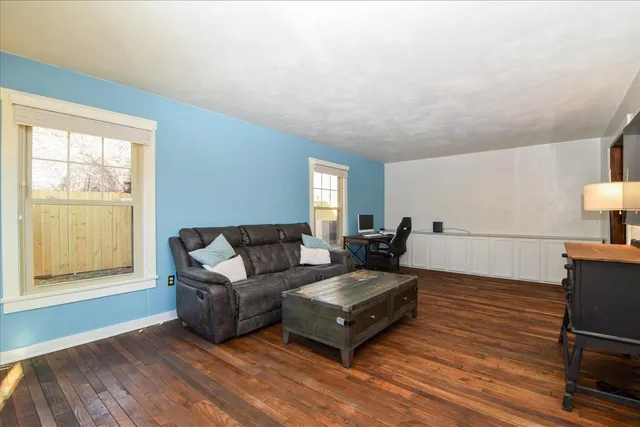 a bedroom with bed and a window