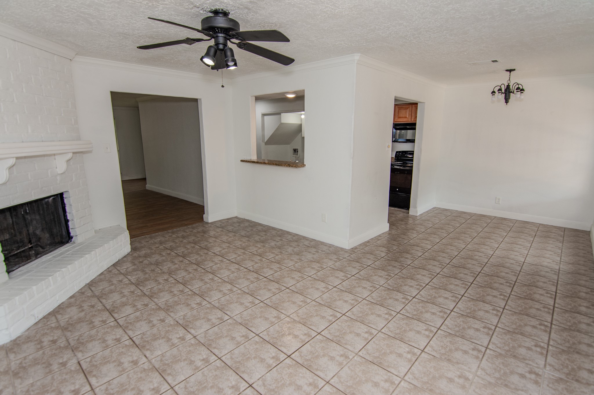 20335 Fieldtree Drive Humble, TX 77338 - Photo 5 of 22 Family Room with Fireplace and Dining Room