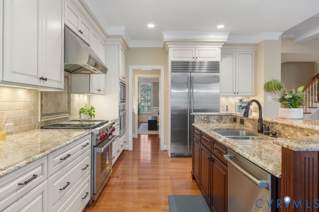 850 Elmslie Lane Manakin-Sabot, VA 23103 - Photo 14 of 48 a kitchen with stainless steel appliances granite countertop a sink a stove and a refrigerator