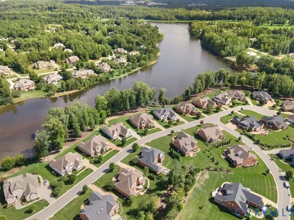an aerial view of residential houses with outdoor space