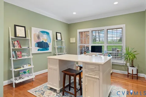 a view of a workspace with furniture and a potted plant