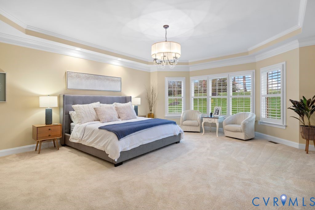 850 Elmslie Lane Manakin-Sabot, VA 23103 - Photo 23 of 48 a spacious bedroom with a bed and a large window