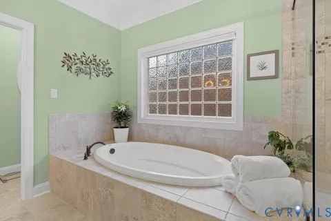 a bathroom with a tub and sink