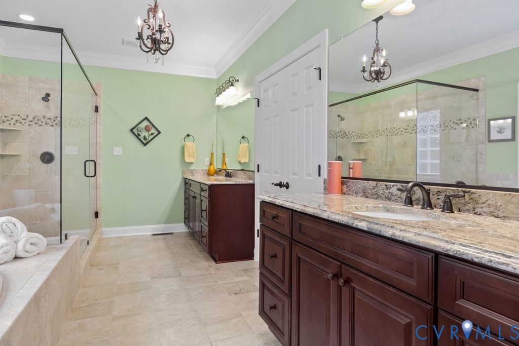 850 Elmslie Lane Manakin-Sabot, VA 23103 - Photo 31 of 48 a spacious bathroom with a granite countertop sink mirror and shower