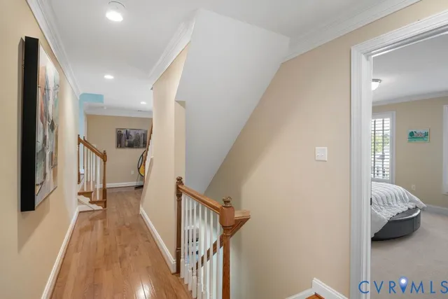 a view of a hallway with a livingroom and furniture