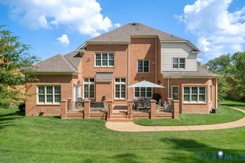 a front view of a house with a yard table and chairs