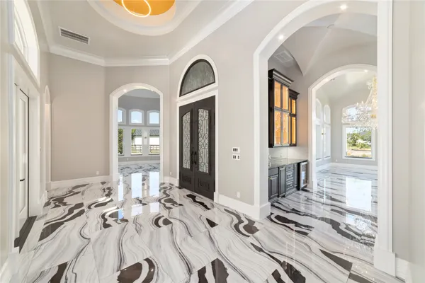 a view of a livingroom with furniture and windows
