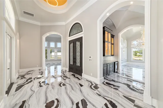 a view of a livingroom with furniture and windows