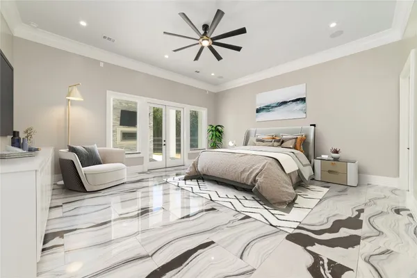 a bedroom with a large bed and a couch