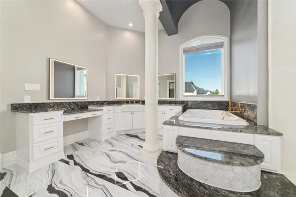 a bathroom with a sink and a mirror